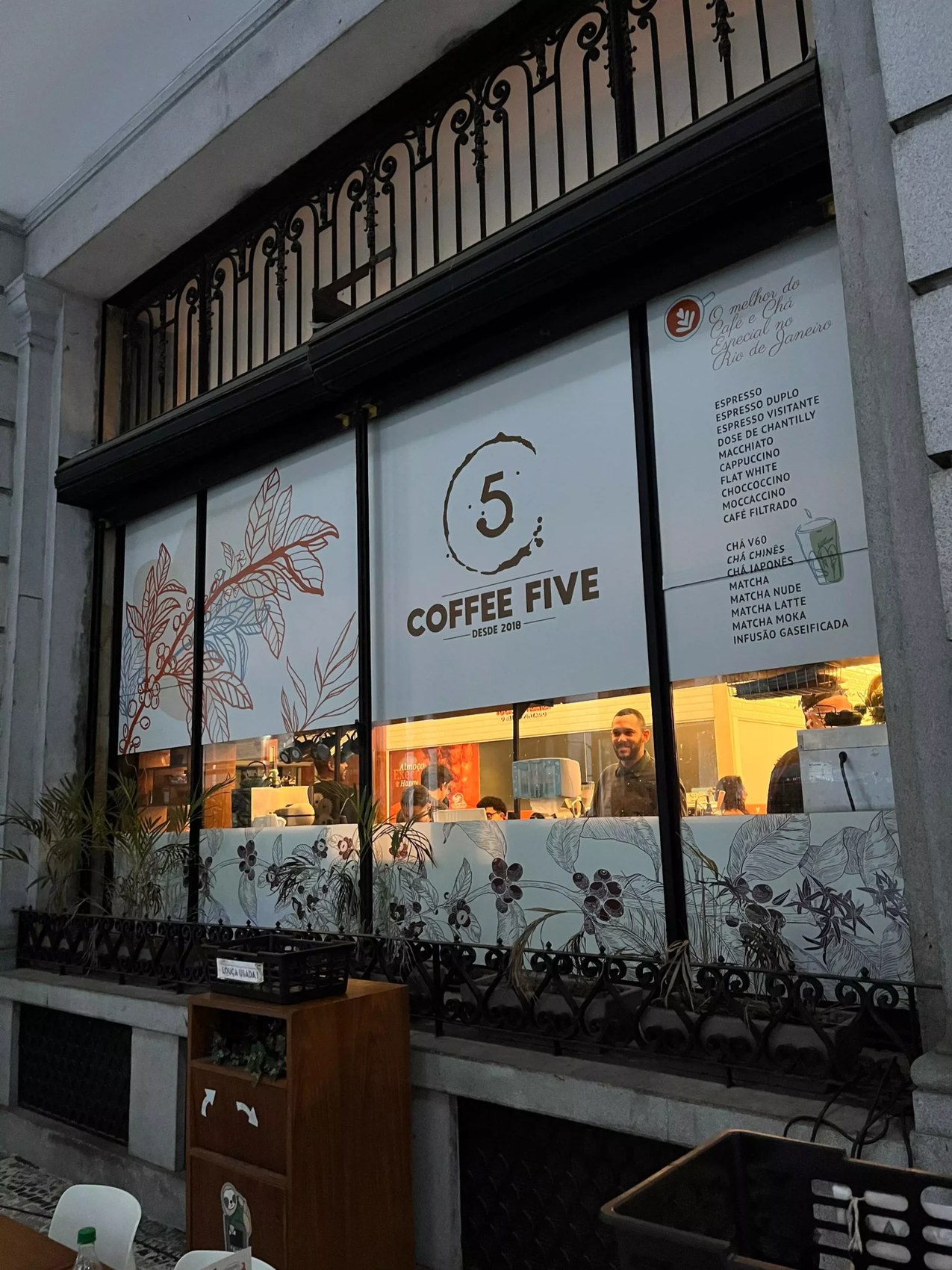 The storefront window with the branded Coffee Five sign and menu